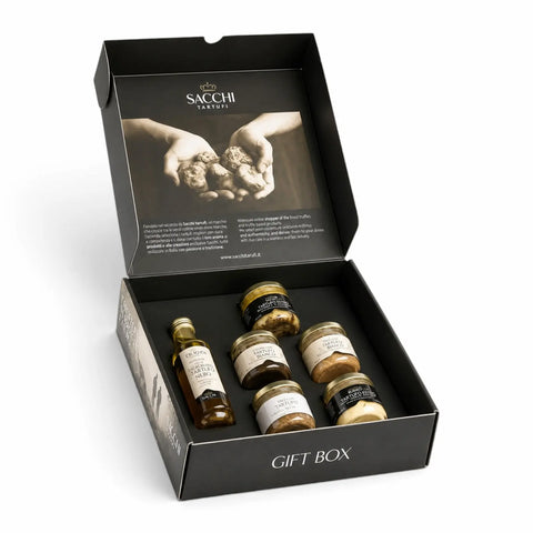 Open Desirée premium truffle gift box with white truffle olive oil, summer truffle sauce, truffle butter and three savoury creams