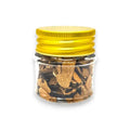 Brown truffle spice jar with yellow lid containing dried black summer truffle Tuber aestivum