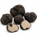 Whole and cut fresh Tuber aestivum A Grade truffles with pale hazelnut interiors and fine marbling