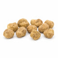 Medium-size fresh Tuber magnatum white truffles with pale ochre surfaces and natural shape variation