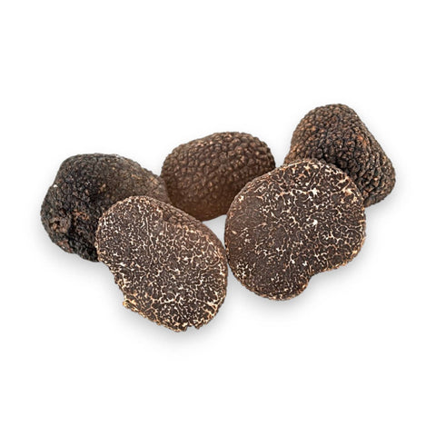 Fresh B Grade Tuber melanosporum prepared for grating into a warm pasta dish