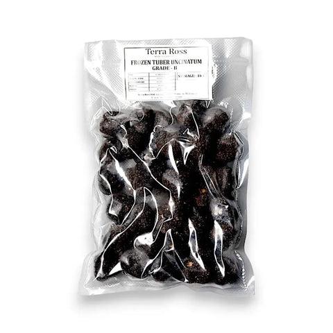 Bag of frozen autumn truffle Tuber Uncinatum B-grade for culinary use