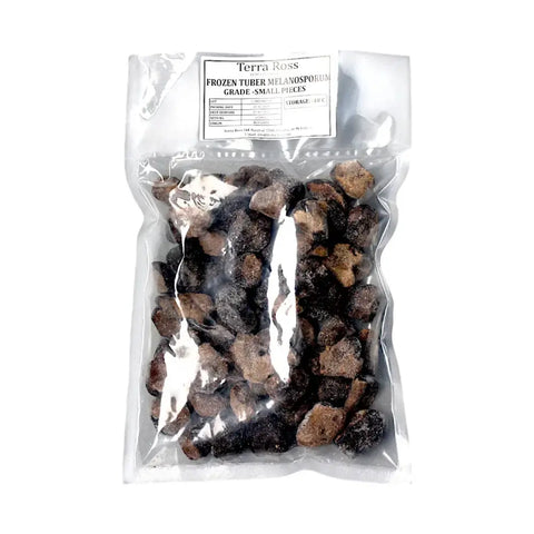 Bag of frozen black truffle pieces from Tuber Melanosporum C-grade for culinary use