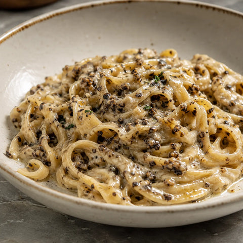 Minced Tuber aestivum summer truffle incorporated into a creamy sauce for even distribution
