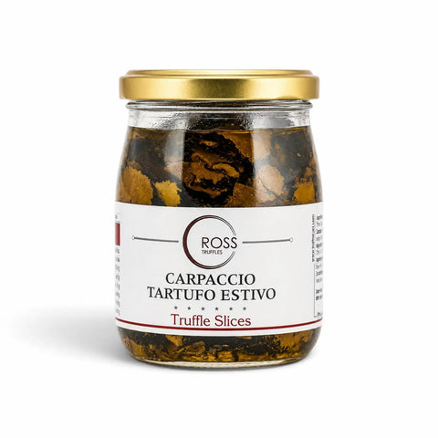 Glass jar containing sliced Tuber aestivum summer truffle carpaccio in olive oil