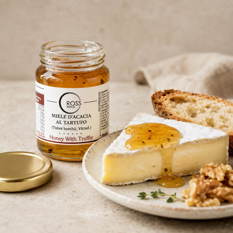White truffle honey with 2% Tuber borchii drizzled over soft cheese